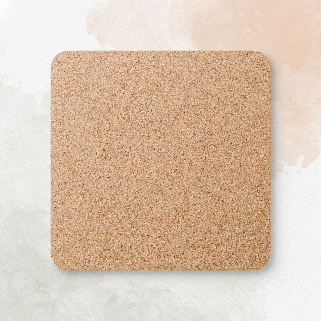 Square cork coaster on a light marble background