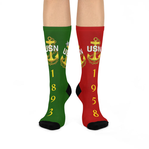 Green and red socks with USN logo and numbers on a white background