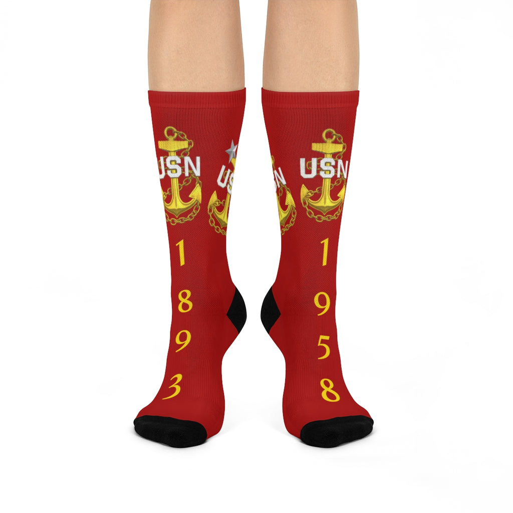 Red socks with USN logo and numbers on a white background