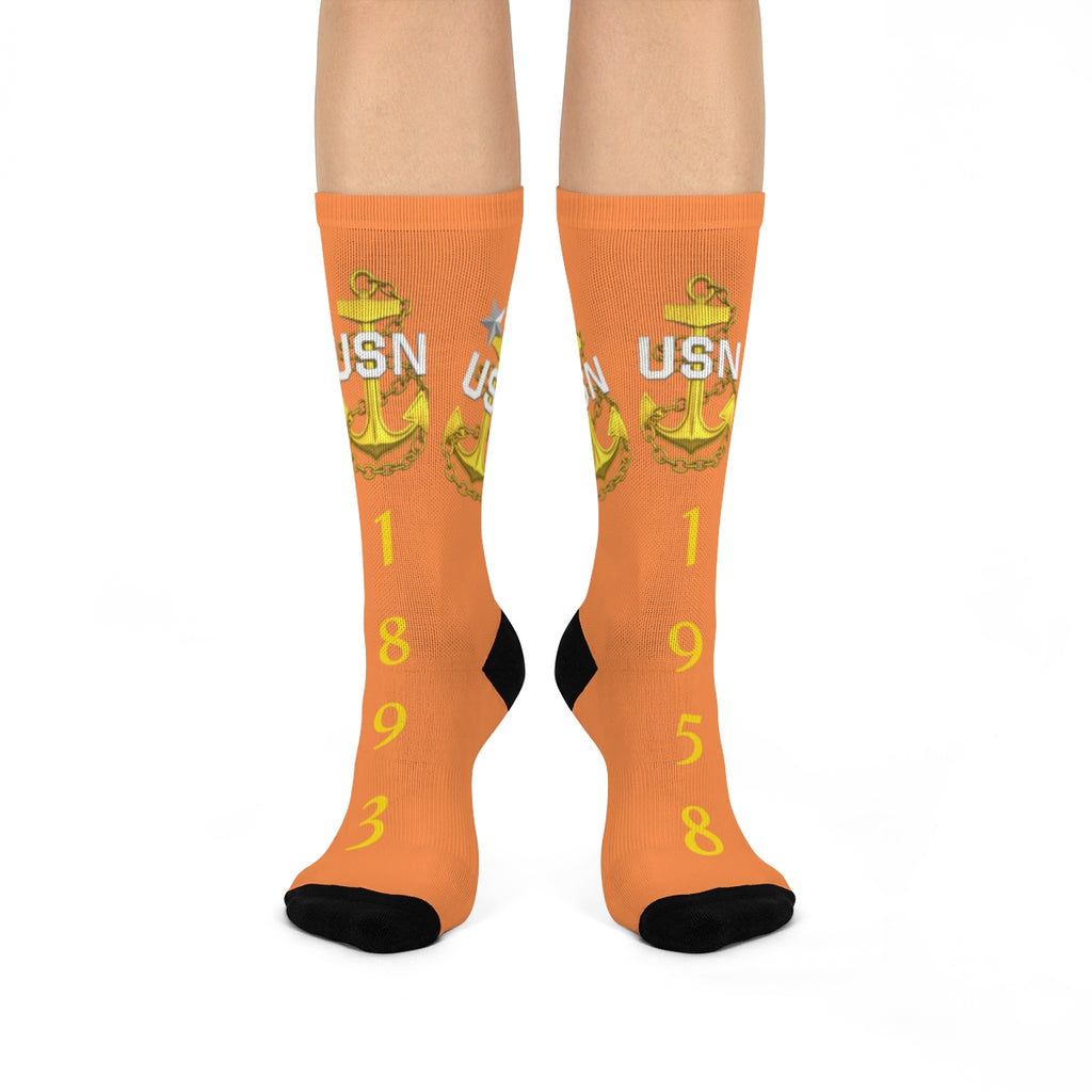 Orange socks with USN logo and numbers on a white background