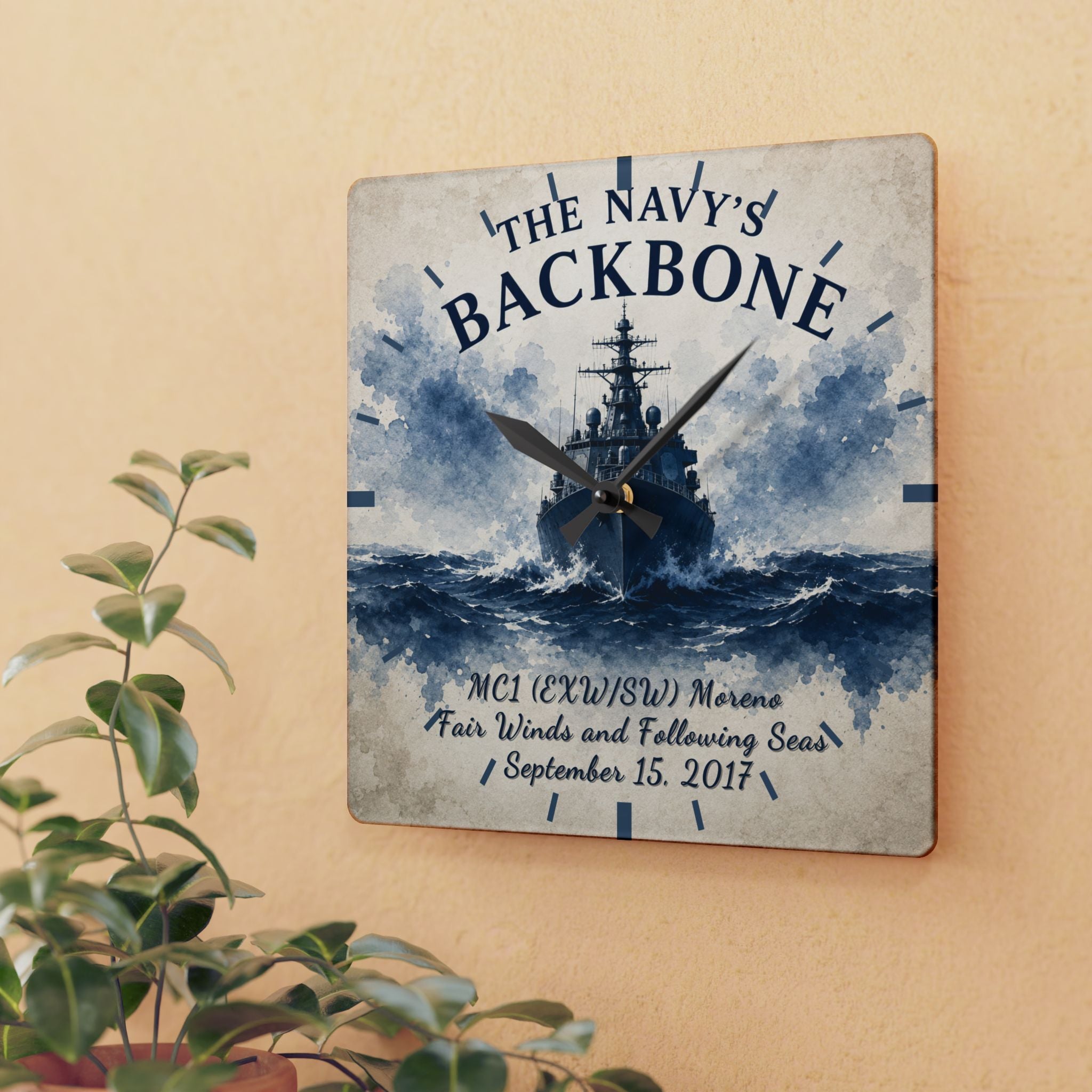 Wall clock with navy ship design and text on a beige wall