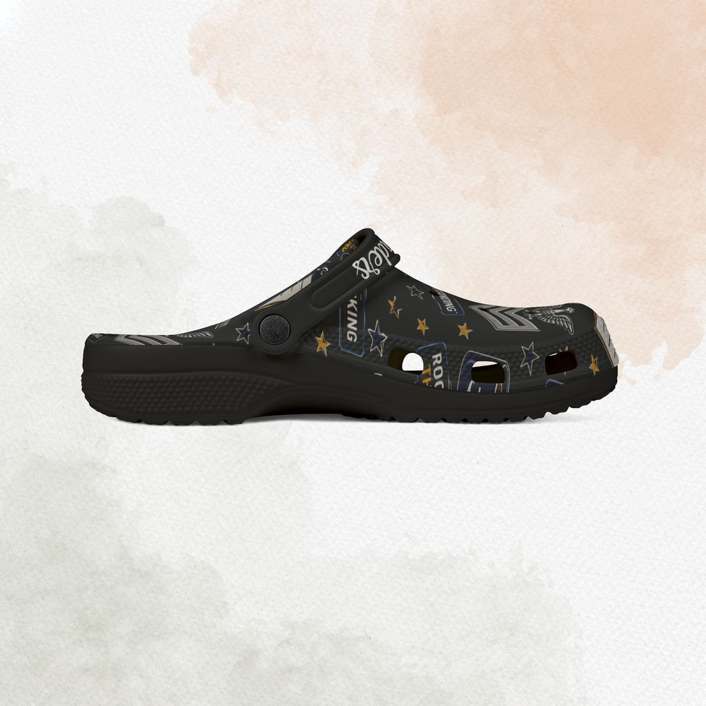 Black clog shoe with star pattern on a white background