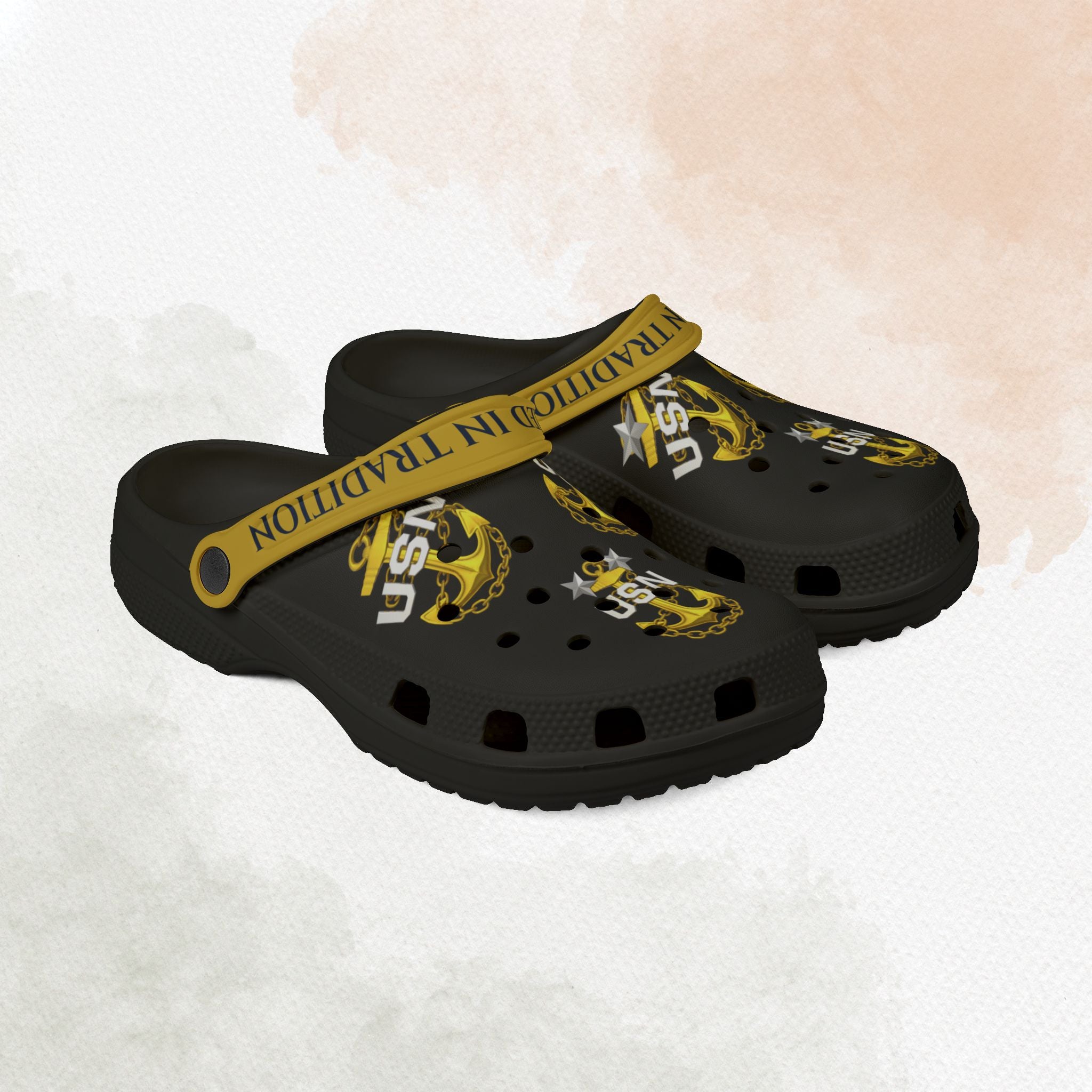 Black clogs with yellow accents and 'USN' logo on a white background