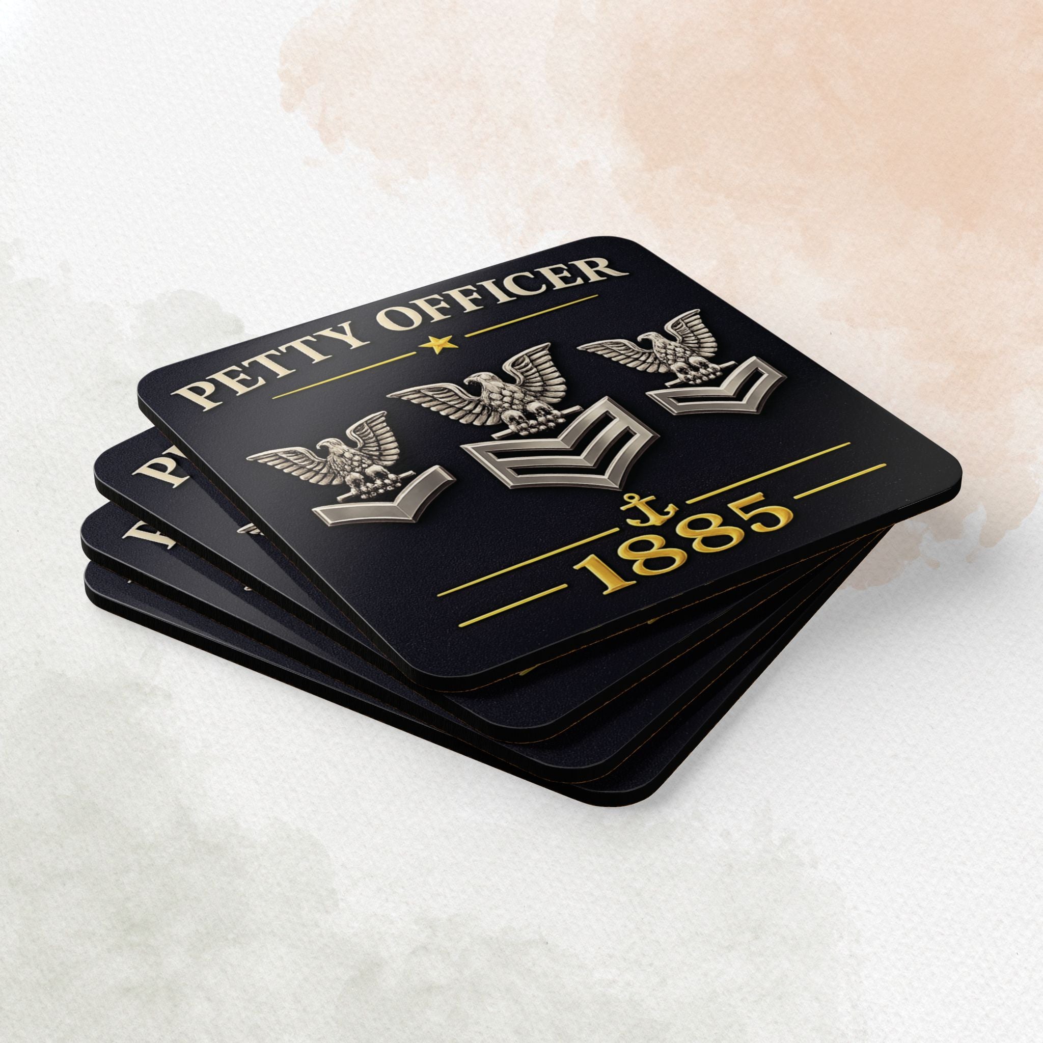 Set of black coasters with 'Petty Officer' and eagle emblem design on a white surface.