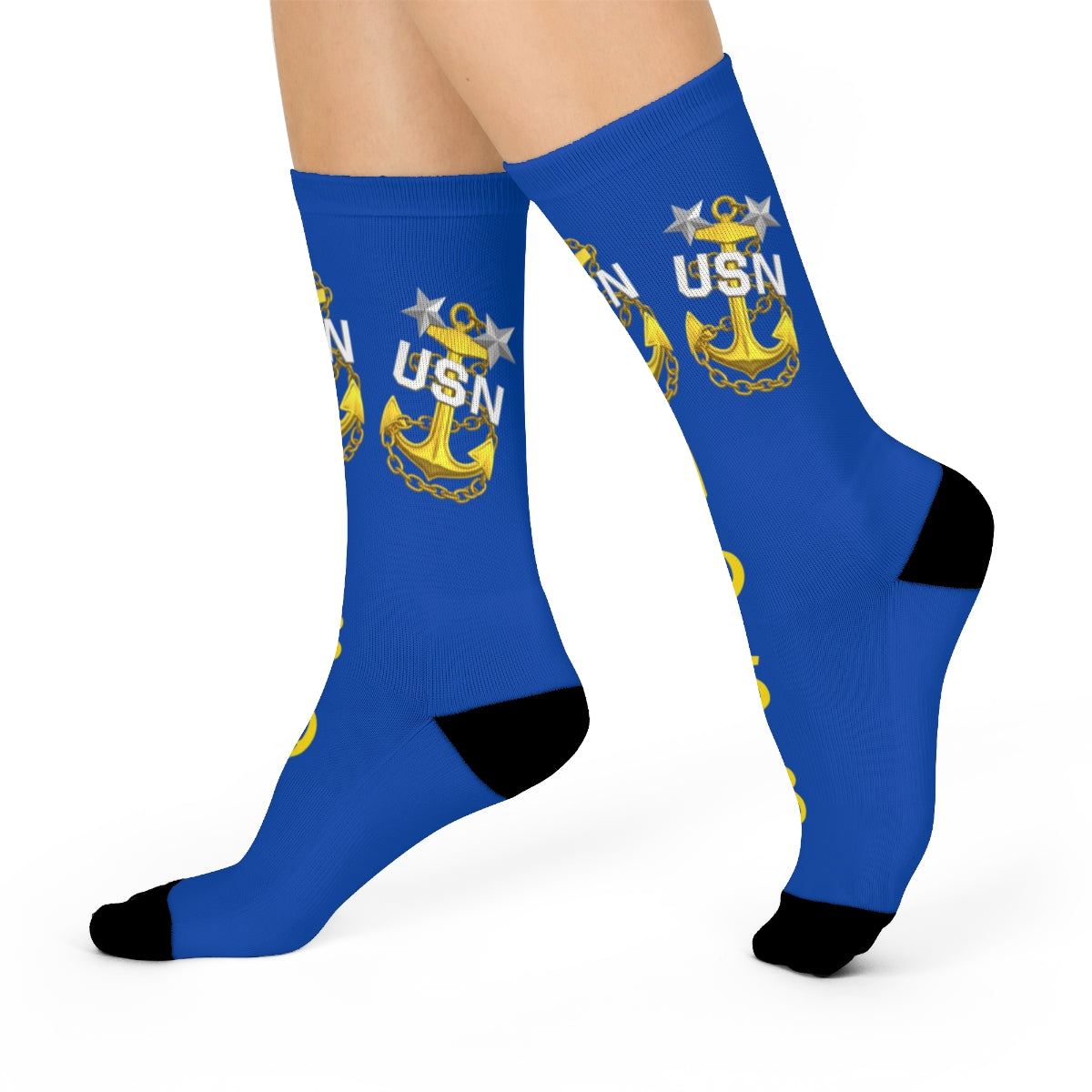 Blue socks with USN logo worn by a person on a white background