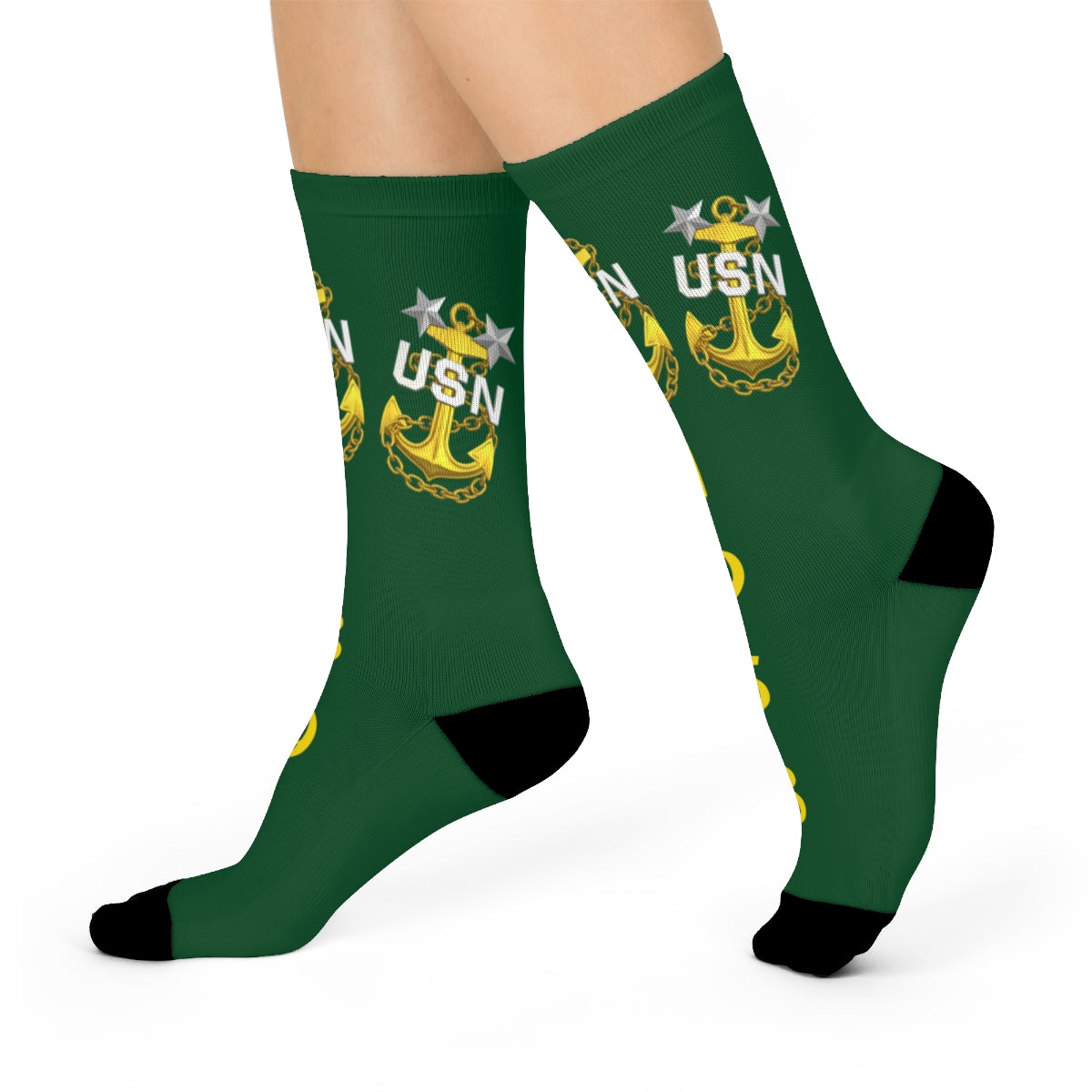 Black socks with yellow USN anchor design on a white background