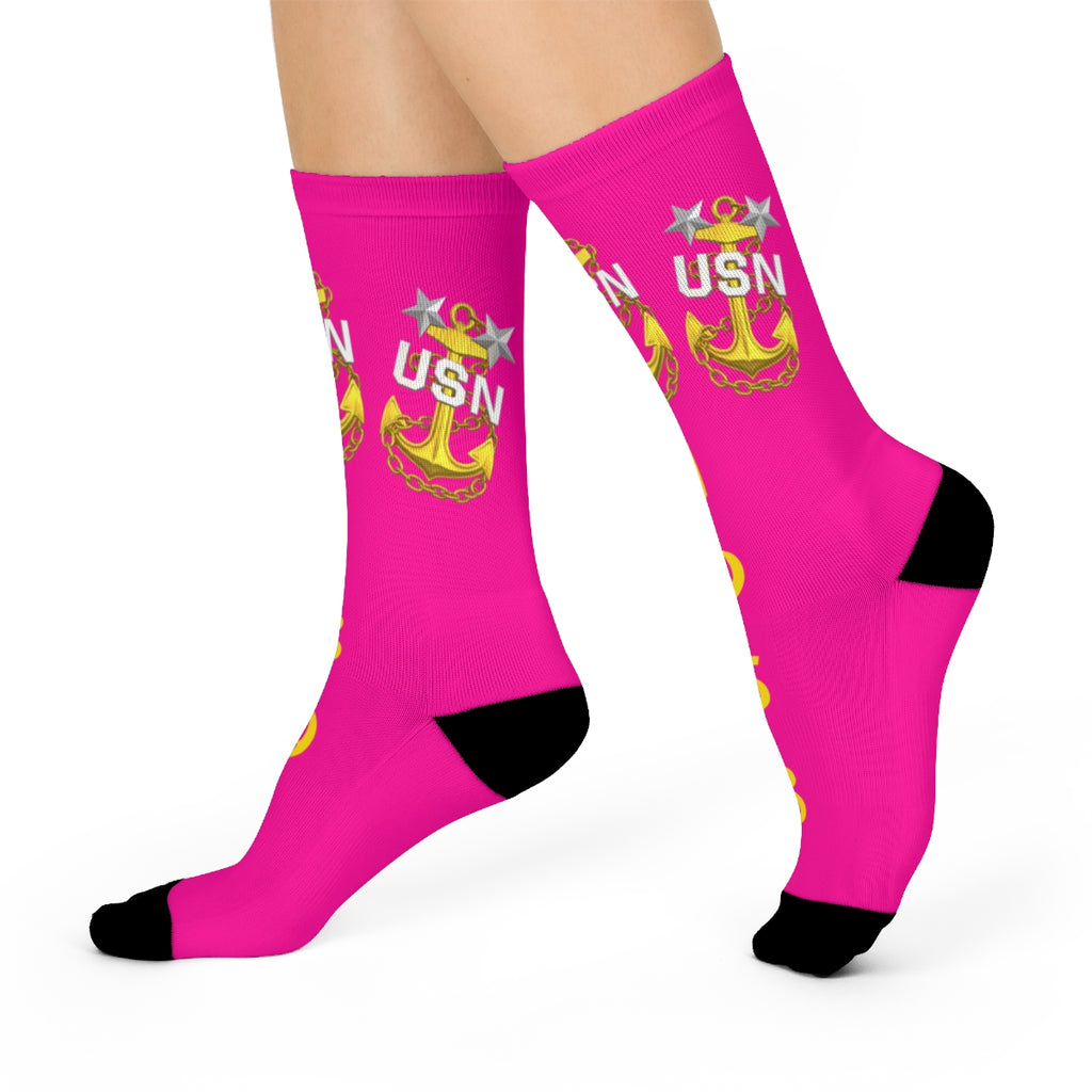Pink socks with USN logo on a white background